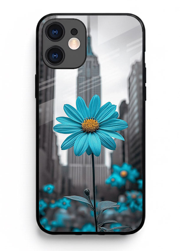 Blue daisy artwork on iphone 12 mini glass back cover with bold modern floral styling.