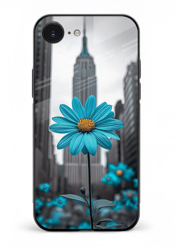 Blue daisy artwork on iphone 16e glass back cover with bold modern floral styling.