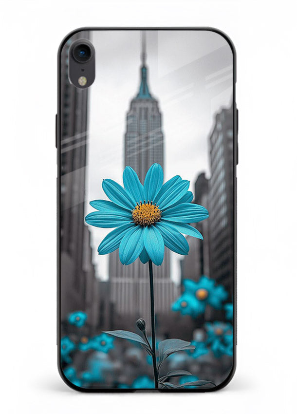 Blue daisy artwork on iphone xr glass back cover with bold modern floral styling.