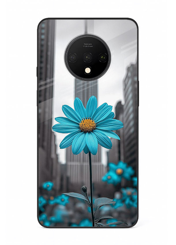 Blue daisy artwork on OnePlus 7T glass back cover with bold modern floral styling.