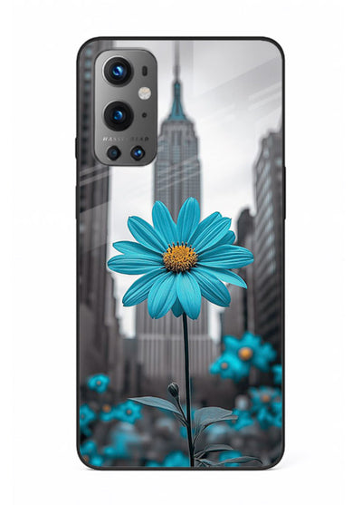 Blue daisy artwork on OnePlus 9 glass back cover with bold modern floral styling.