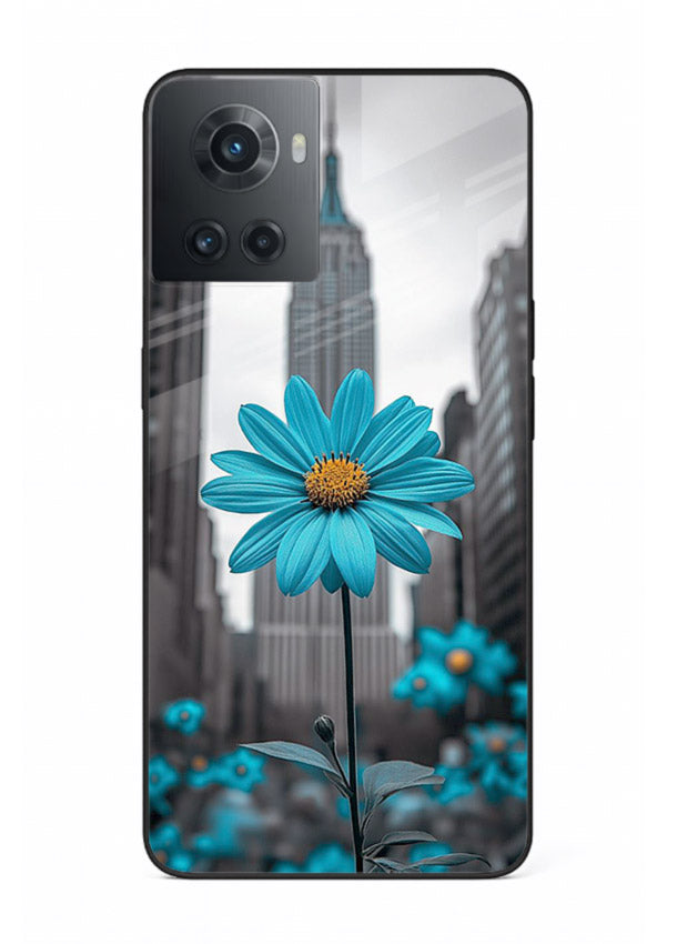 Blue daisy artwork on OnePlus 10R glass back cover with bold modern floral styling.