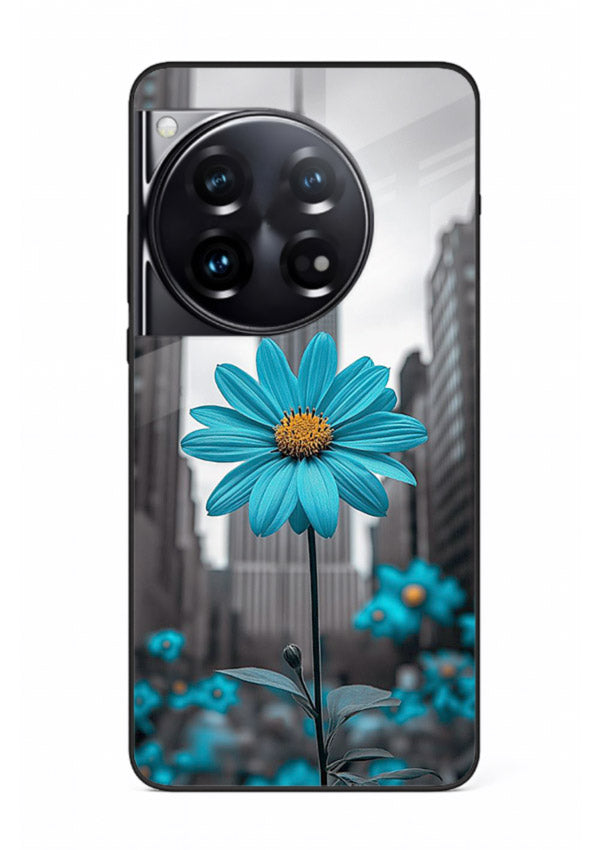 Blue daisy artwork on OnePlus 12 glass back cover with bold modern floral styling.