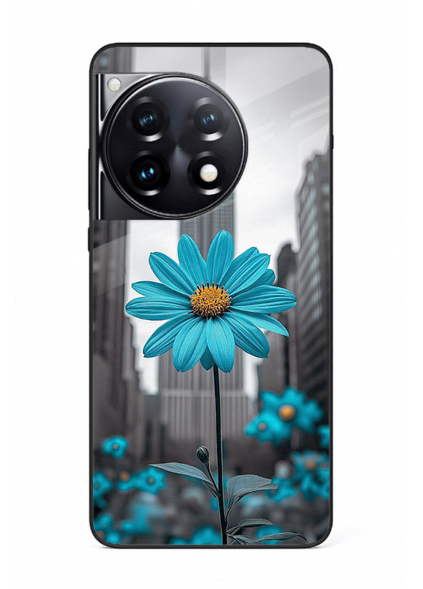 Blue daisy artwork on OnePlus 12R glass back cover with bold modern floral styling.