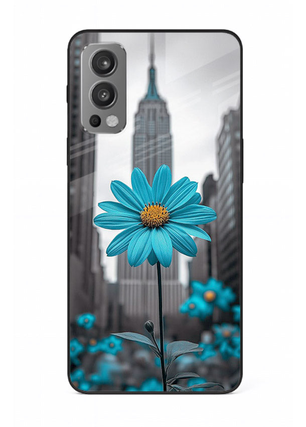 Blue daisy artwork on OnePlus Nord 2 glass back cover with bold modern floral styling.