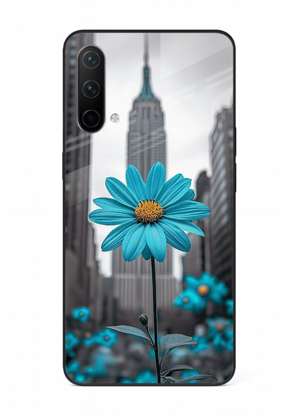 Blue daisy artwork on OnePlus Nord CE 5G glass back cover with bold modern floral styling.