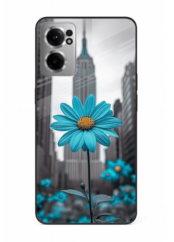 Blue daisy artwork on OnePlus Nord CE2 5G glass back cover with bold modern floral styling.