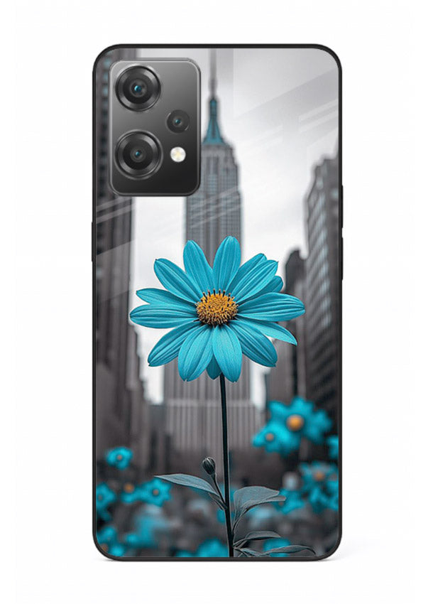 Blue daisy artwork on OnePlus Nord CE2 Lite 5G glass back cover with bold modern floral styling.