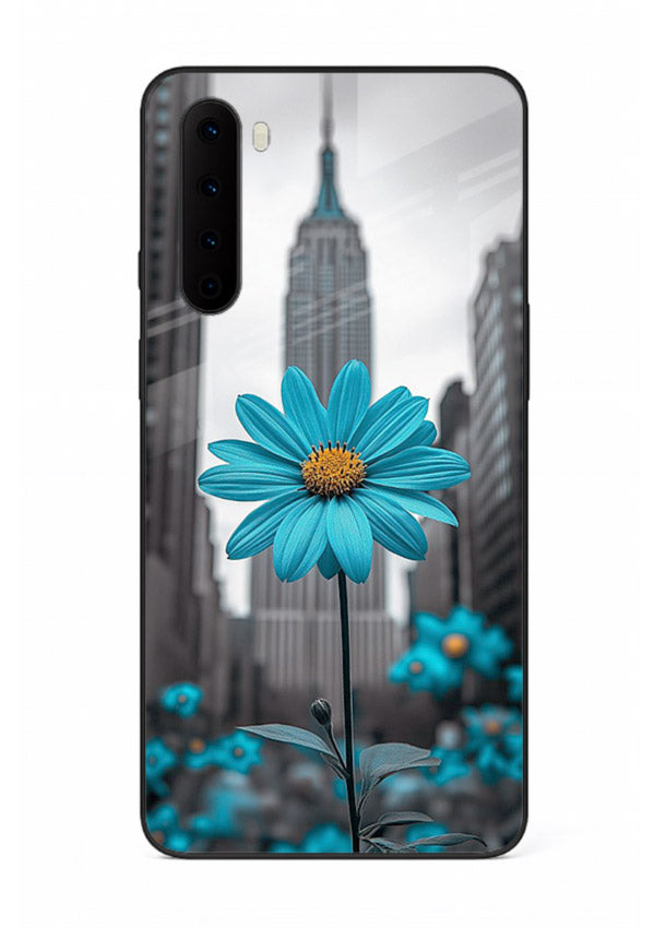 Blue daisy artwork on OnePlus Nord glass back cover with bold modern floral styling.