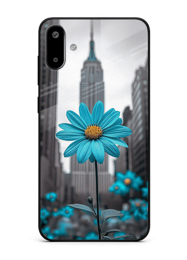 Blue daisy artwork on Samsung F06 5G glass back cover with bold modern floral styling.